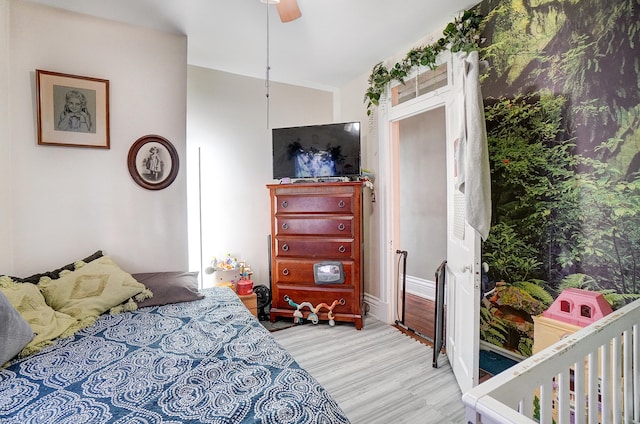 bedroom with a ceiling fan and wood finished floors