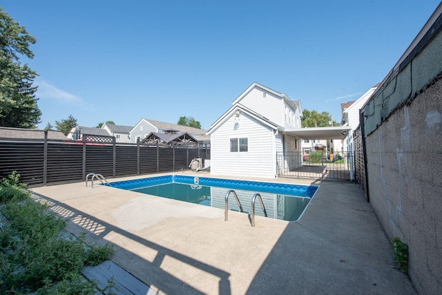 view of pool featuring a patio, fence, and a fenced in pool