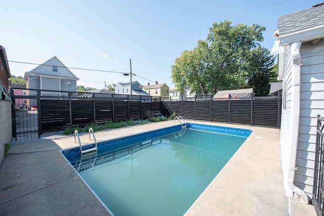 view of swimming pool featuring a fenced in pool and a fenced backyard