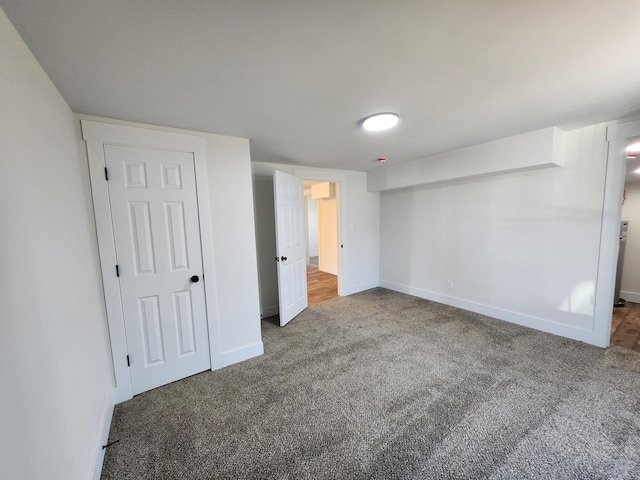 unfurnished bedroom with baseboards and carpet floors