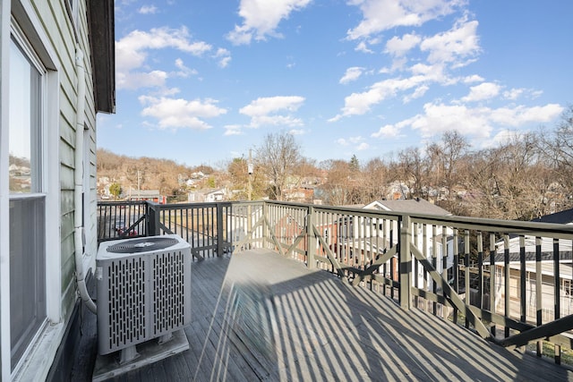 view of wooden balcony with a wooden deck and central AC