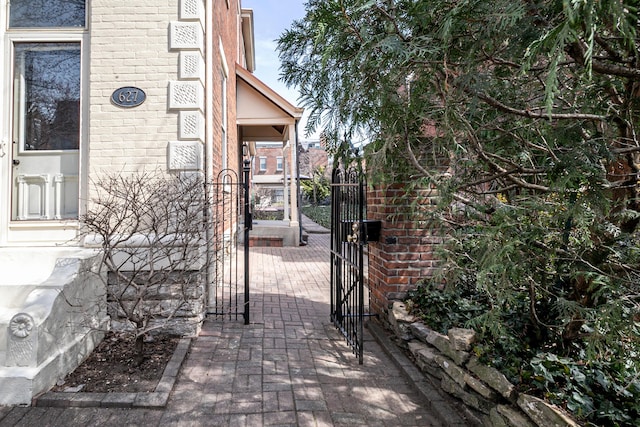 view of patio with fence and a gate