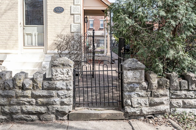 view of gate with fence