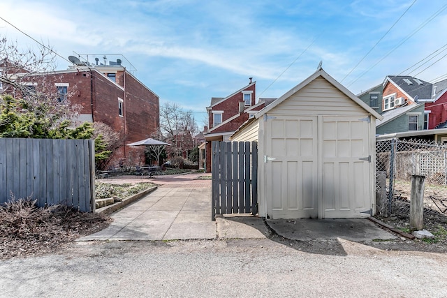 view of shed with fence