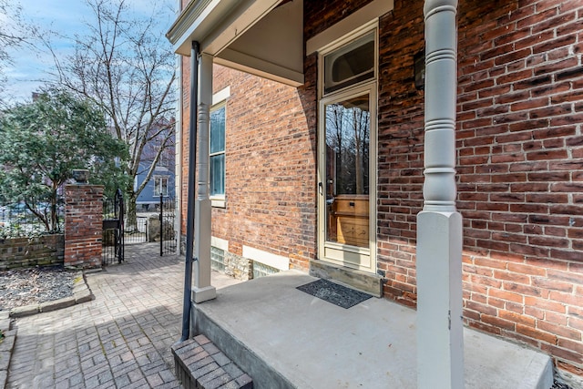 view of patio with a gate