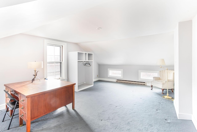 carpeted office space featuring baseboard heating, lofted ceiling, and baseboards