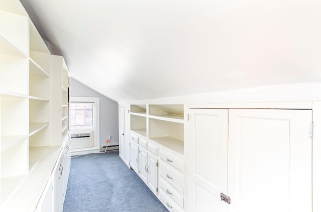 walk in closet featuring cooling unit, light colored carpet, baseboard heating, and vaulted ceiling