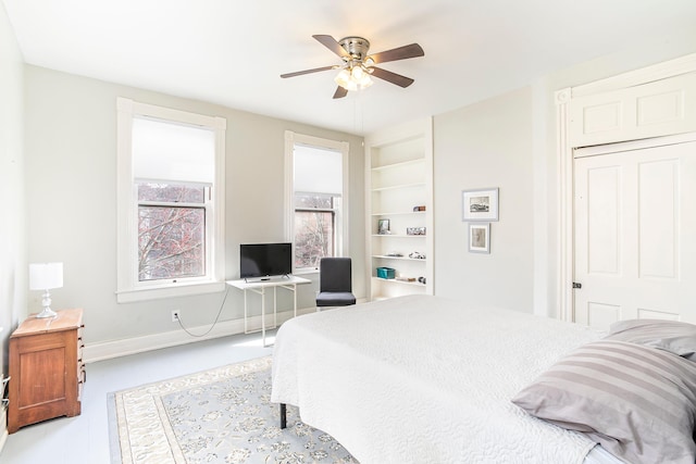 bedroom featuring a ceiling fan and baseboards