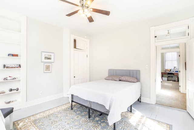 bedroom with baseboards and ceiling fan