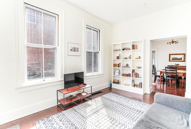 living area featuring wood finished floors and baseboards