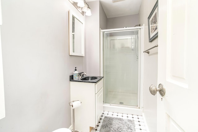 bathroom featuring a stall shower and vanity