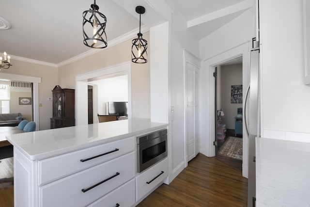 kitchen with light countertops, white cabinets, dark wood-style floors, and stainless steel appliances