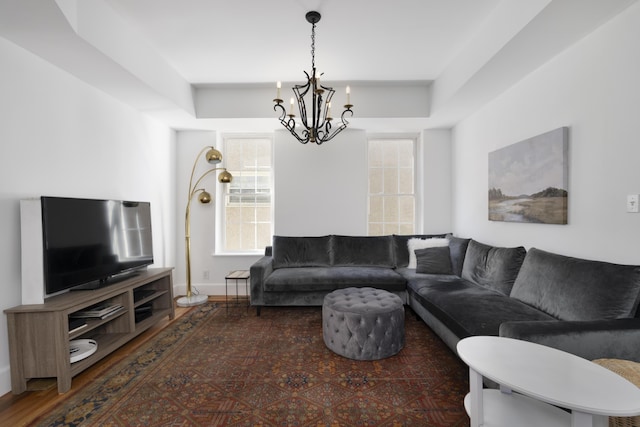 living area with a notable chandelier