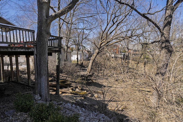 view of yard featuring a wooden deck