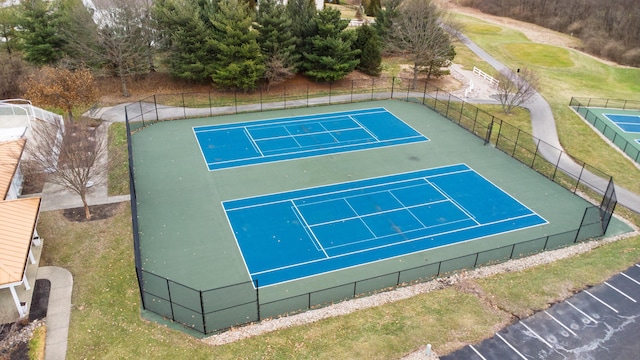 view of sport court featuring fence