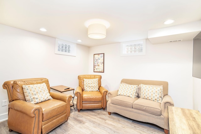 living room featuring recessed lighting, visible vents, and light wood finished floors