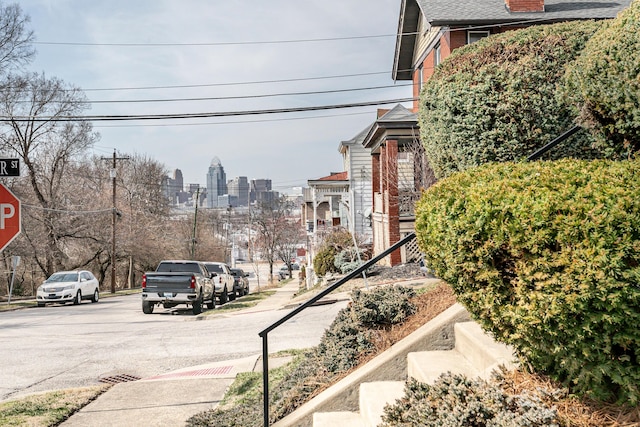 view of road with sidewalks and a city view