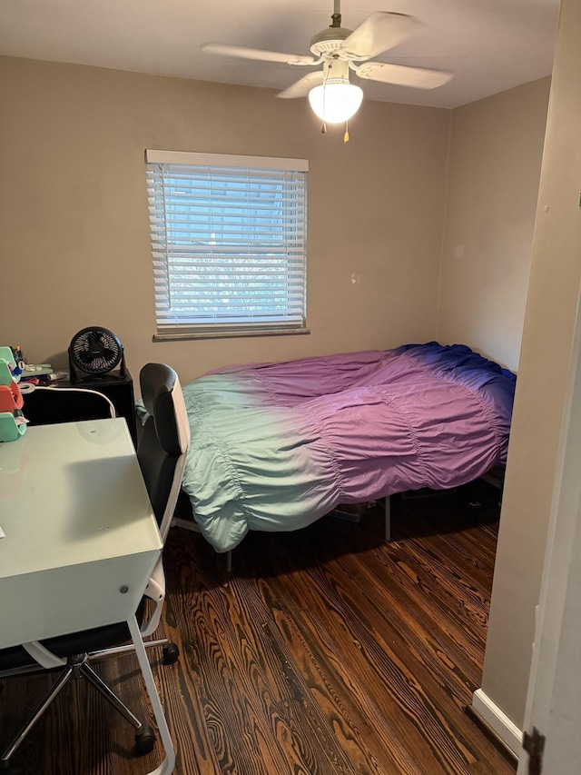 bedroom featuring ceiling fan and wood finished floors