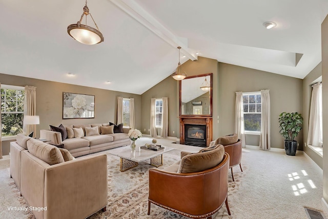 living room featuring visible vents, baseboards, a fireplace with flush hearth, lofted ceiling with beams, and light carpet