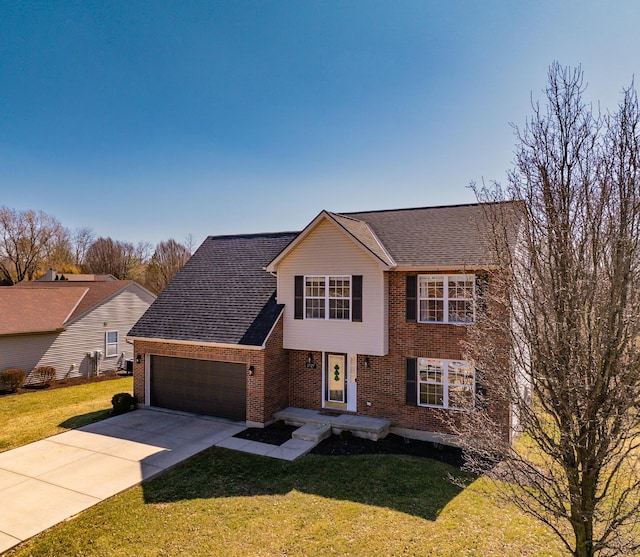 view of front of home with driveway, a front lawn, brick siding, and an attached garage