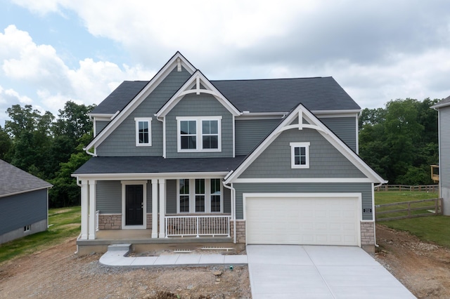 232 Chardonnay Vly, Walton, KY 41094 - craftsman-style home featuring a porch, concrete driveway, stone siding, and a garage