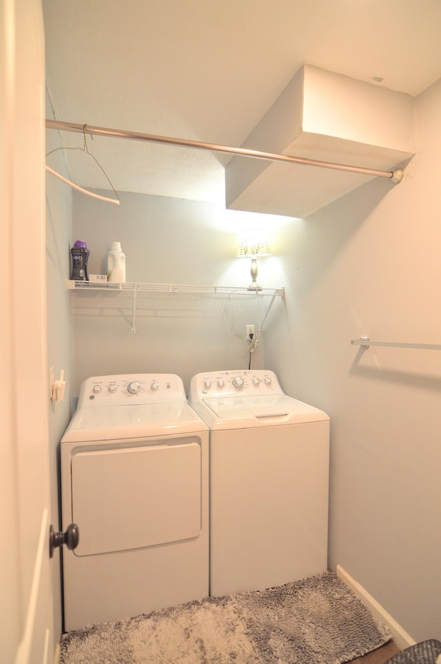 washroom with washer and dryer and laundry area