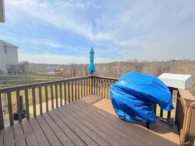 wooden deck with a rural view