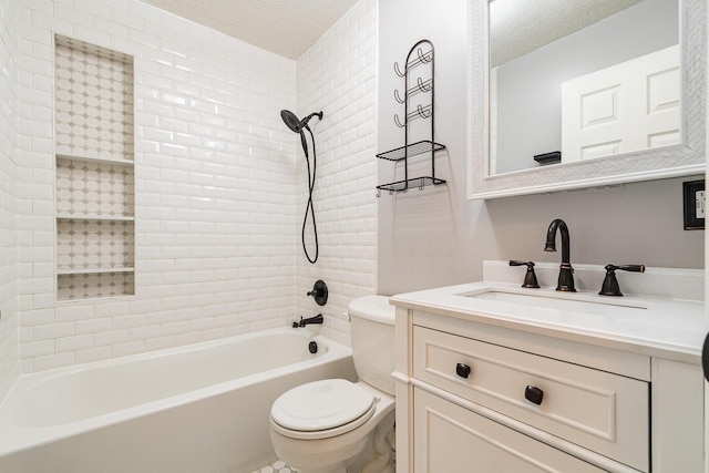 bathroom featuring vanity, toilet, tub / shower combination, and a textured ceiling