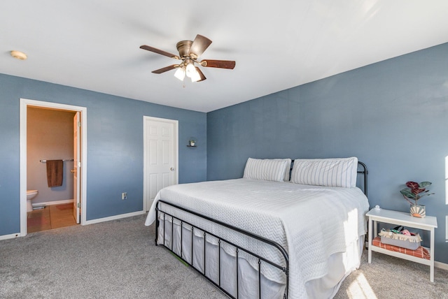 bedroom featuring connected bathroom, baseboards, carpet, and ceiling fan