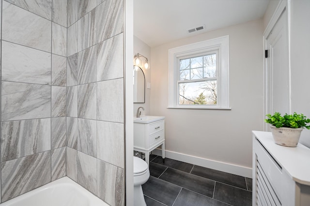 bathroom featuring tile patterned floors, visible vents, toilet, baseboards, and vanity