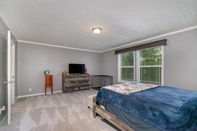 bedroom with baseboards, carpet floors, a textured ceiling, and crown molding