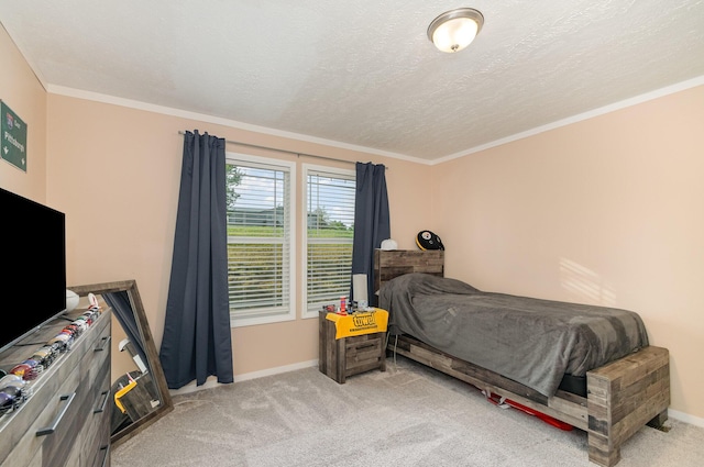 carpeted bedroom with crown molding, baseboards, and a textured ceiling