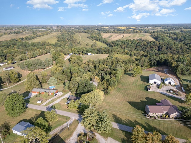 birds eye view of property with a forest view