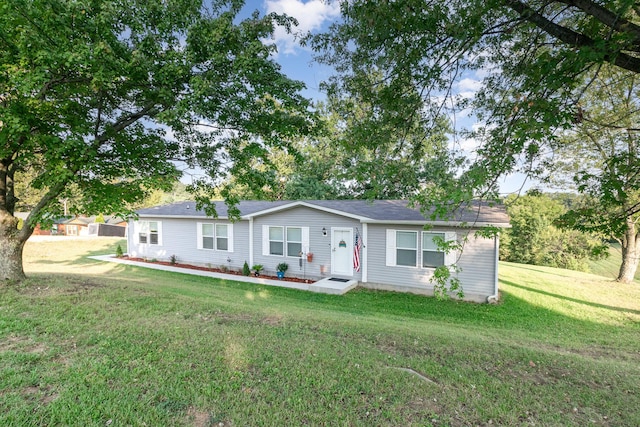 single story home with a front yard