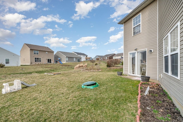 view of yard featuring a residential view