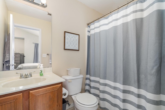 full bathroom featuring vanity, toilet, and visible vents