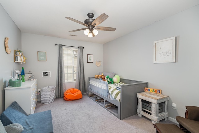 bedroom featuring visible vents, baseboards, carpet, and a ceiling fan