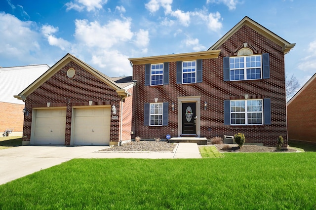 colonial home featuring a front lawn, brick siding, concrete driveway, and an attached garage