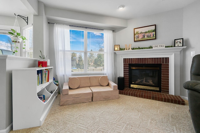 living area with a fireplace and carpet