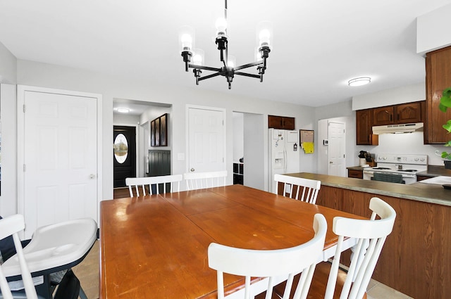 dining area with a chandelier