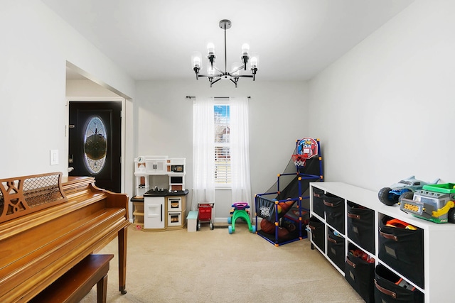 game room featuring carpet floors and an inviting chandelier