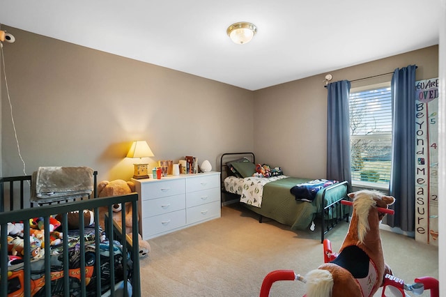 bedroom with light colored carpet