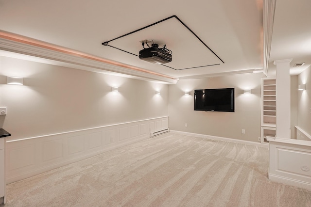 cinema room with visible vents, a baseboard radiator, wainscoting, crown molding, and light carpet