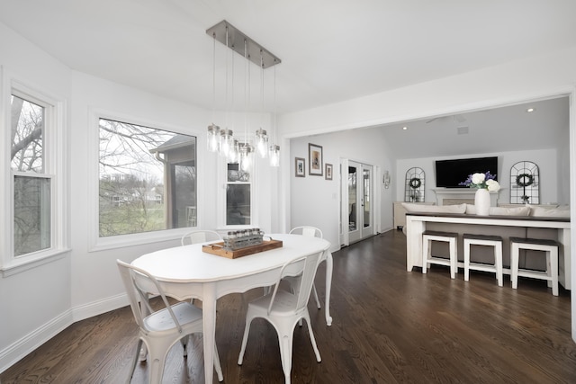 dining room featuring a wealth of natural light, baseboards, dark wood finished floors, and recessed lighting