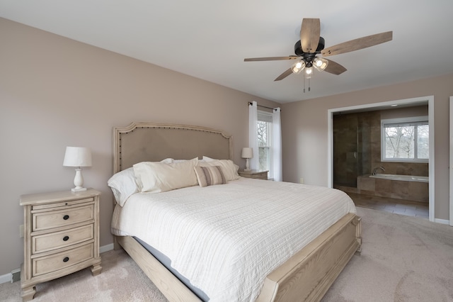 bedroom featuring multiple windows and light carpet