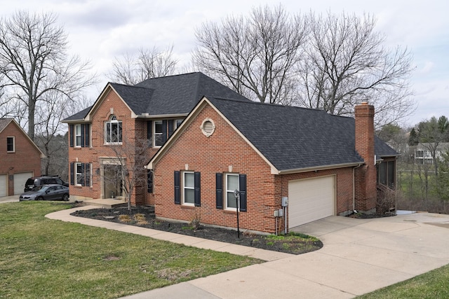 view of front of property with concrete driveway, a front yard, an attached garage, brick siding, and a chimney