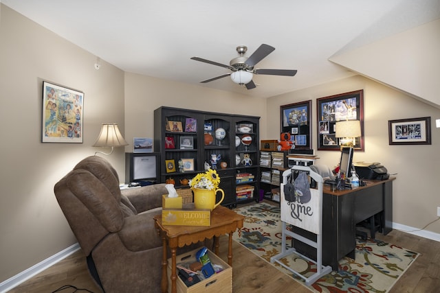 office space featuring baseboards, wood finished floors, and ceiling fan