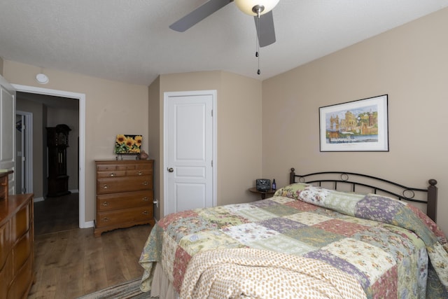 bedroom featuring wood finished floors and a ceiling fan