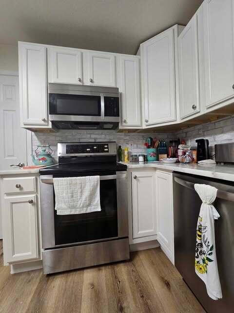 125 Smith Ave, Warsaw, KY 41095 - kitchen featuring white cabinets, stainless steel appliances, and light countertops