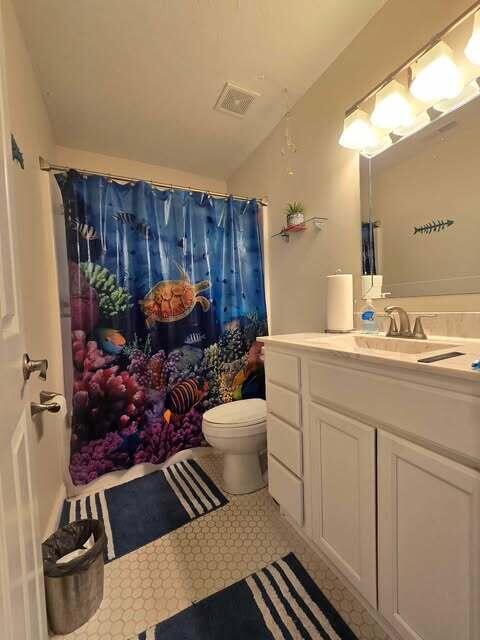 125 Smith Ave, Warsaw, KY 41095 - bathroom with visible vents, toilet, a shower with curtain, tile patterned flooring, and vanity